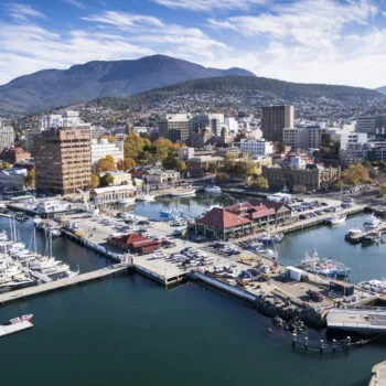 Aerial view of Hobart marina and cityscape with Mount Wellington in the background