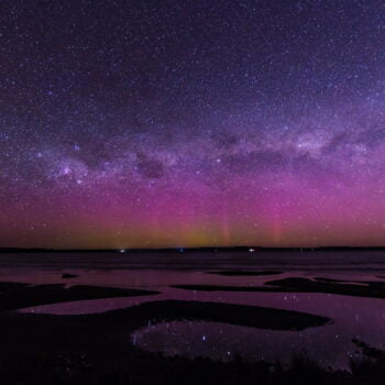 Aurora Australis from Strahan Tasmania. Starlight over a beach vista with a green glow on the horizon.
