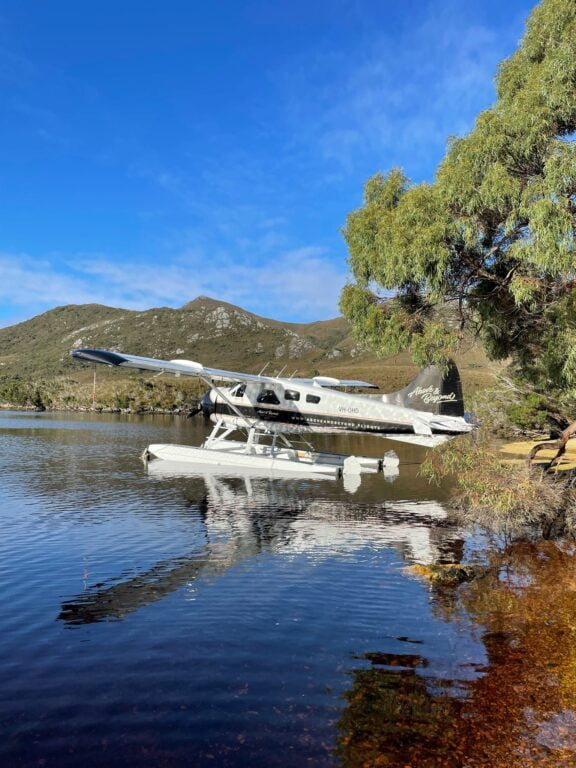 Above and beyond seaplane on a lake with mountains in the background
